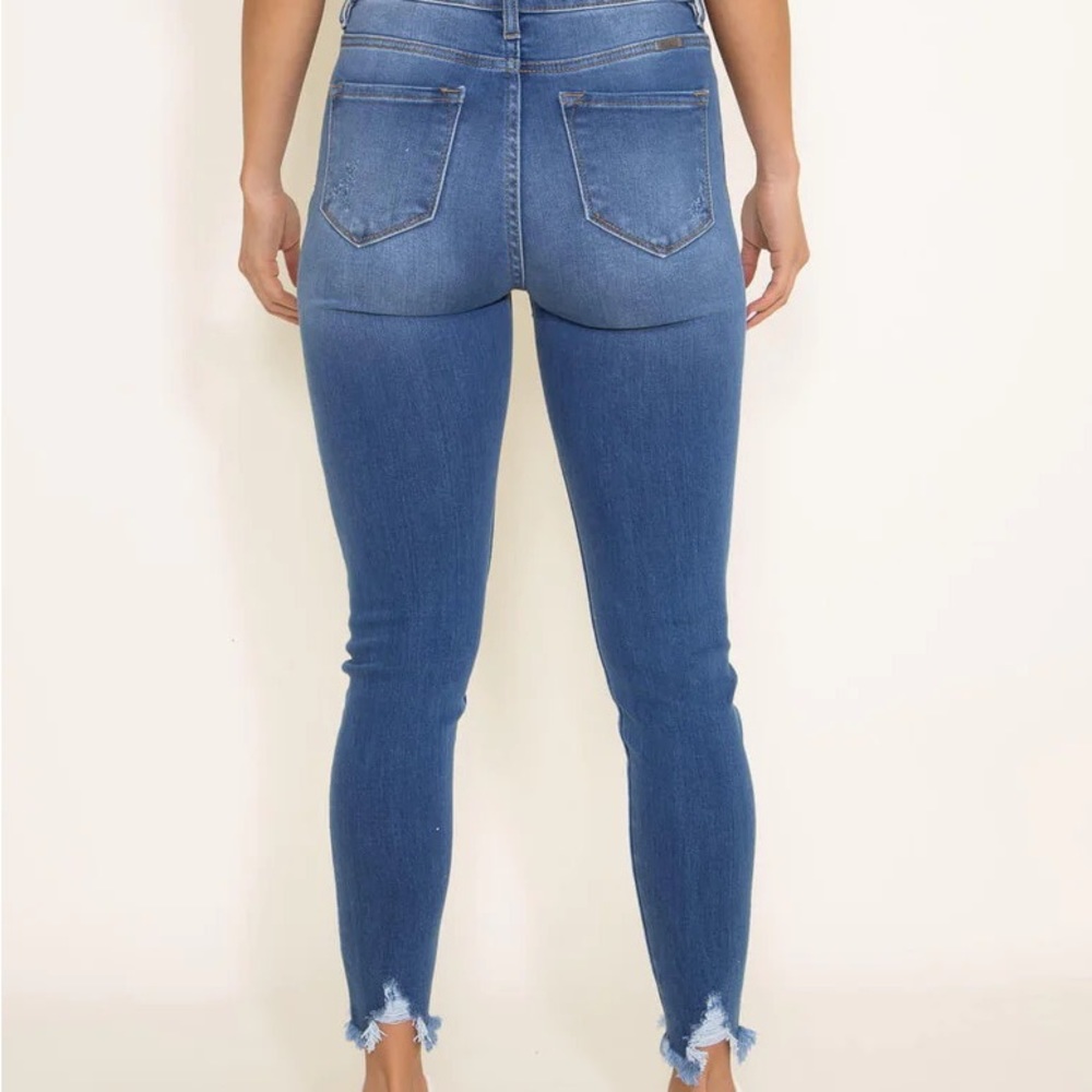 fashionable retro vintage style frayed dark Jeans